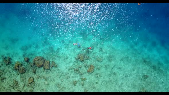 Aerial above abstract of idyllic coast beach time by turquoise water with white sand background of a