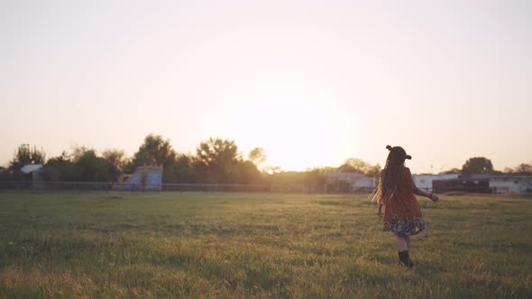 Attractive Fun Hippie Woman with Dreadlocks in the Woods at Sunset Having Good Time Outdoors