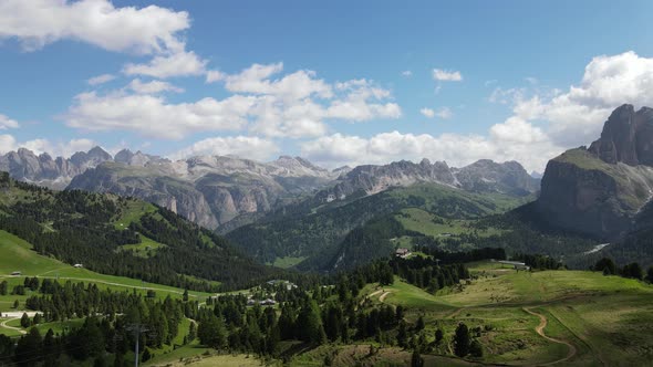 Dolomites on a sunny day with clouds. Beautiful nature, fresh air.  Drone aerial view of Italy natur