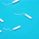 Menstrual tampons move on a blue background. Cotton tampon for women. - VideoHive Item for Sale