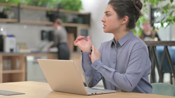 Indian Woman Having Wrist Pain While Using Laptop