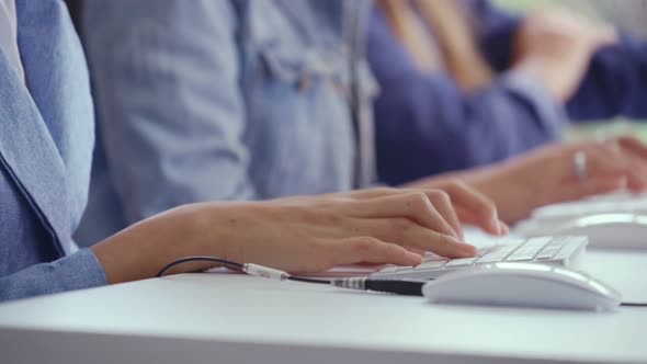 Close Up Shot of Businesswoman Hand Typing and Working on Computer on Desk