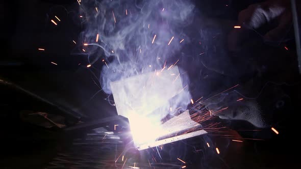 Close view of arc welder sparking