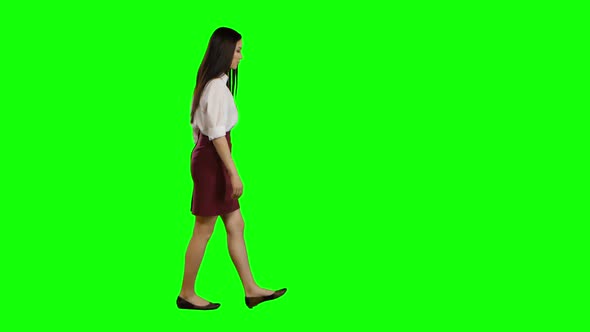 Girl Goes To Work and Waves Her Hand. Green Screen. Side View