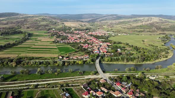 Aerial drone view of the Fagaras, Romania. Multiple residential buildings, road