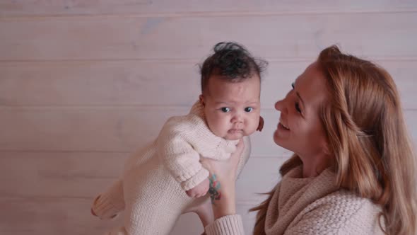 Mother is Having Fun with Her Baby Daughter