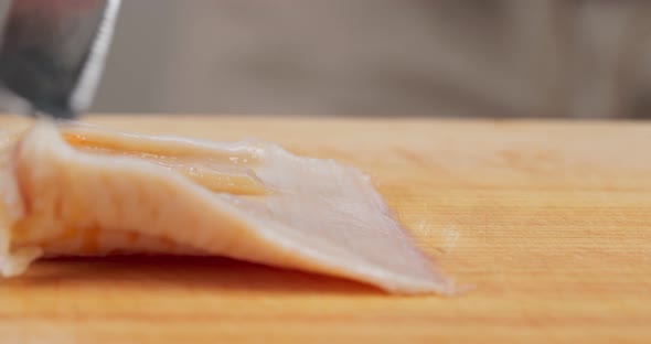 Cutting Fresh Geoduck on wooden board