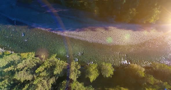 Low Altitude Flight Over Fresh Fast Mountain River with Rocks at Sunny Summer Morning