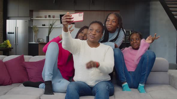 Excited African Teenage Girls and Mom Taking Selfie Shot