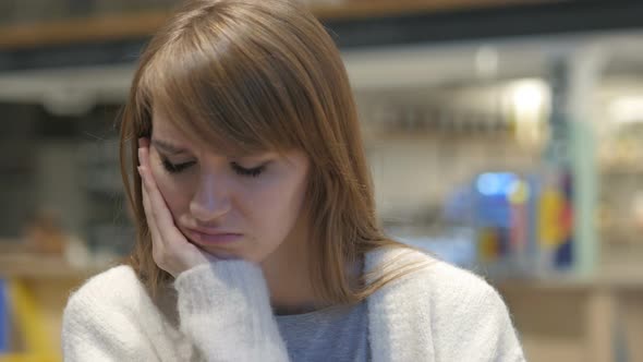 Headshot of Young Woman with Tooth Infection, Toothache