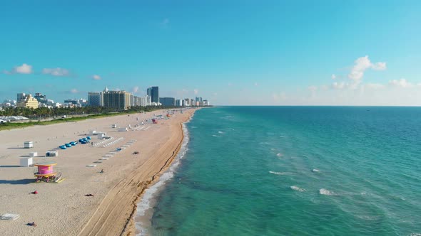 Miami South Beach Sunrise with Lifeguard Tower and Coastline with Colorful Cloud and Blue Sky South