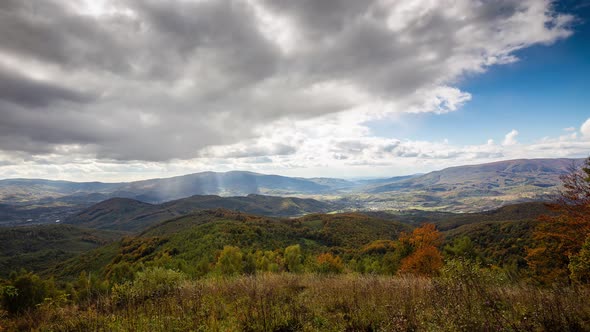 Beautiful time-lapse in the autumn mountains. Sun rays in the mountains.