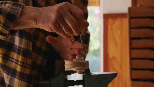 Female luthier at work in her workshop