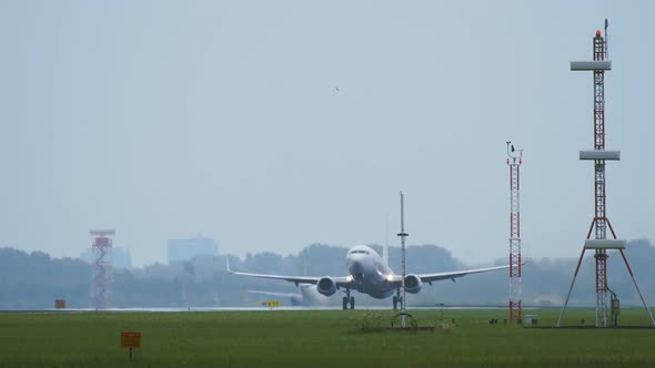 Twin Engine Widebody Airplane Takes off in the Morning