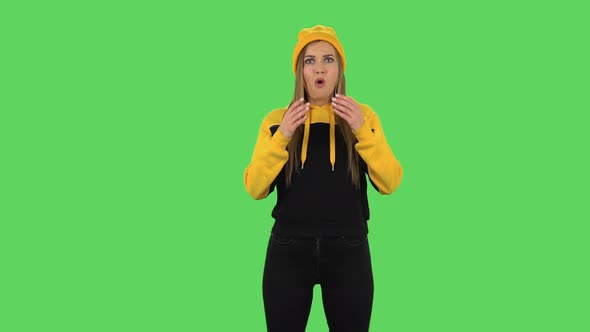 Modern Upset Girl in Yellow Hat with Shocked Wow Face Expression. Green Screen