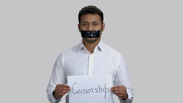 Portrait of Indian Rally Activist Showing Censorship Banner
