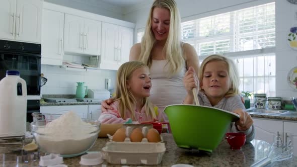 Family making Christmas cookies at home