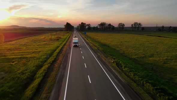 Amazing Aerial Drone View White Lorry Delivering Goods By Road