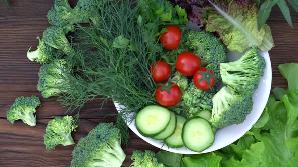 Arrange Fresh Raw Vegetables on a Platter. Platter of Fresh Vegetables on Board. Top View