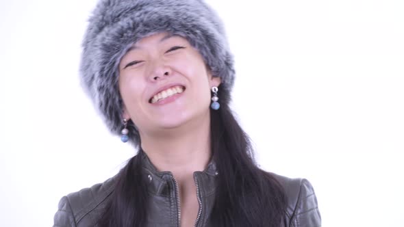 Face of Happy Beautiful Asian Woman Smiling Ready for Winter