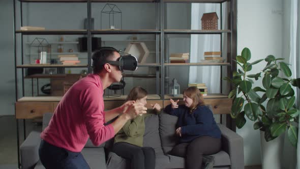 Excited Man Testing Virtaul Reality Headset Indoors