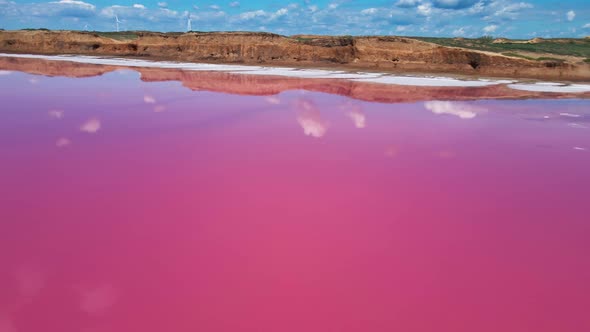 Cinematic Drone Flight Over Beautiful Amazing Lake with Pink Water