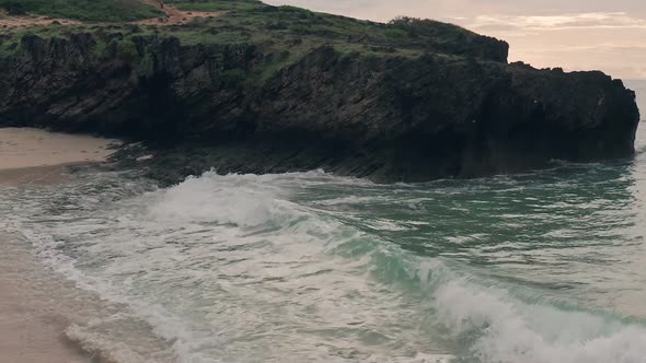 Slow motion drone view of waves crashing on beach at Watamu near Malindi in Kenya. Aerial drone view