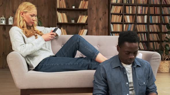 Bored Distant Mixed Race Couple Ignoring Each Other