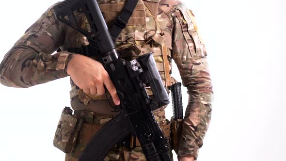 Navy SEAL soldier wearing a multicam tactical outfit at plate carrier