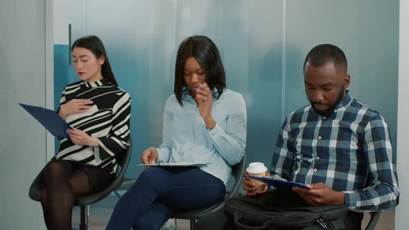 Multiethnic Group of Candidates Waiting to Start Job Interview Meeting