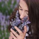 Closeup Portrait of a White Girl Sniffing Lavender Flowers in a Summer Bright Dress Lavand Field - VideoHive Item for Sale