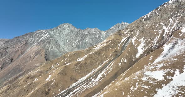 Aerial view of beautiful snowy mountains near Kazbegi, Georgia