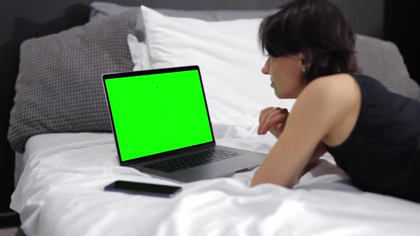 Woman with Green Screen Laptop