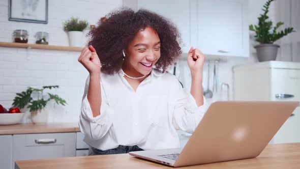 Overjoyed African Woman Rejoices Feel Euphoric Win Online Lottery at Laptop