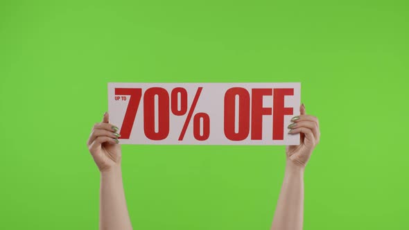 70 Percent Off Advertisement Inscription on Paper Sheet in Womans Hands on Chroma Key. Slow Motion