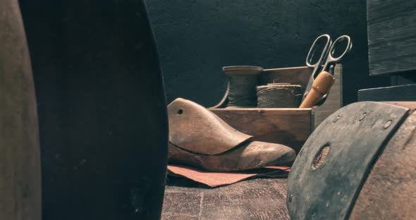 Cobbler workshop with tools, strap, leather. Shoemaker workshop.