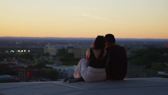 Couple sitting and admiring the view from Mount Royal