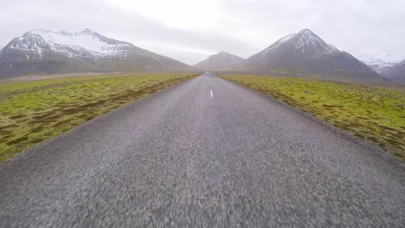Driving in Iceland across beautiful countryside