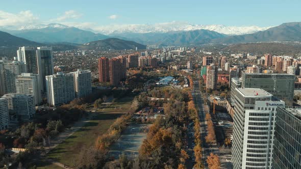 Araucano Park Surrounded By Modern Building Structures In Las Condes, Santiago, Chile. aerial sidewa