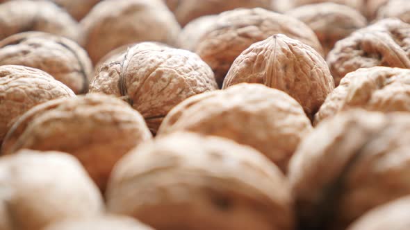 Walnut background of hard shell fruit arranged  natural organic food 4K 2160p 30fps UltraHD footage 