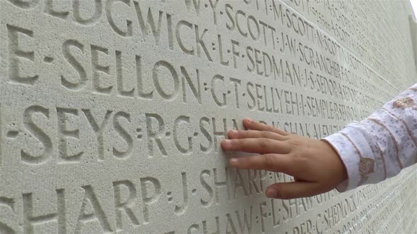Canadian National Vimy Memorial, World War I, France. A young girl pays tribute to fallen soldiers.