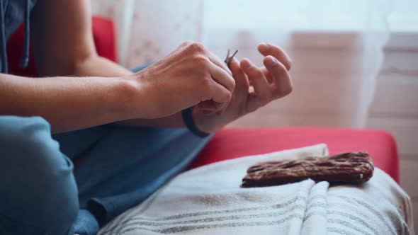 Man Cuts His Nails in the Room