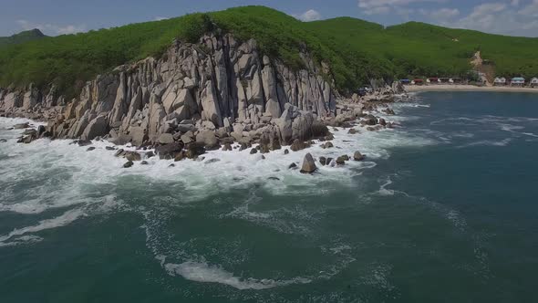 View From a Droneon a Stone Cape Washed By Strong Waves