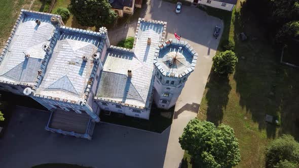 Vecauce Manor in Latvia Aerial View of the Pink Castle Through the Park. Vecauce Castle Tower With a