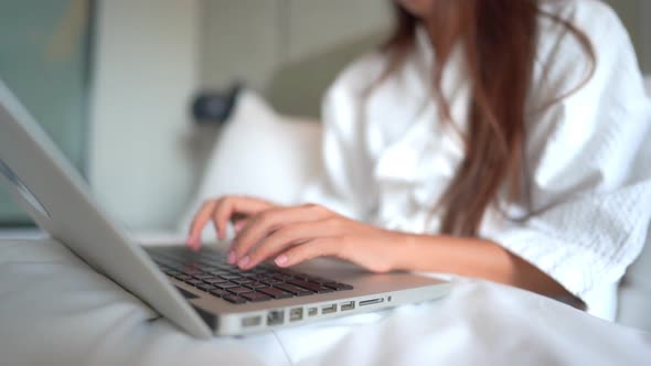 Young asian woman use laptop