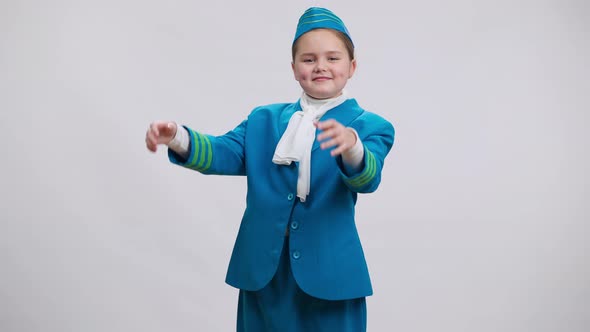 Cheerful Proud Girl Gesturing Yes Looking at Camera Posing in Flight Attendant Uniform at White