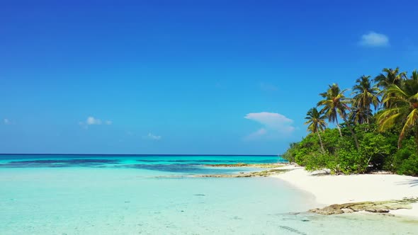 Aerial top down panorama of paradise coastline beach voyage by blue lagoon with white sand backgroun