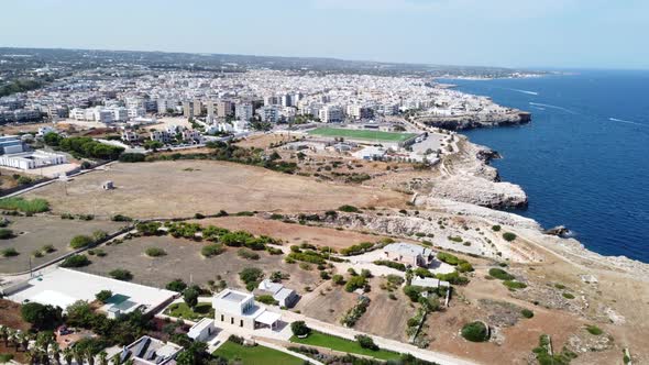 Aerial View Of The Town Of Polignano A Mare On The Adriatic Sea In Puglia, Italy. 4k