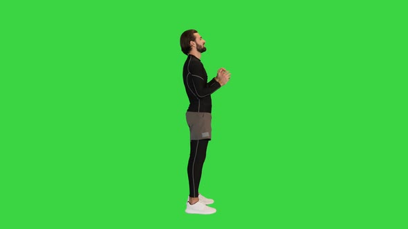 Male Volleyball Player Bouncing a Ball on a Green Screen Chroma Key