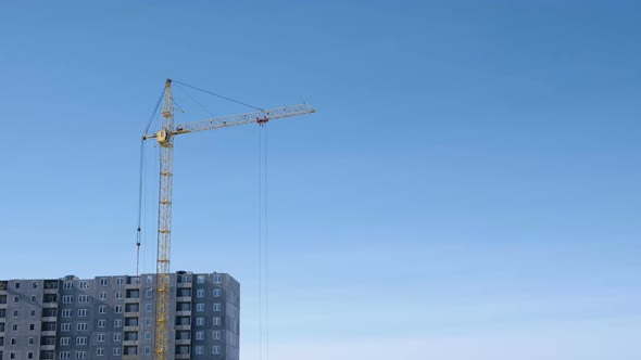 Construction of a Multi-storey Building. Crane Turns To the Side